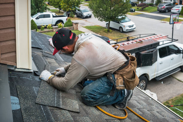 Professional Roofing technician working in South Huntington, NY